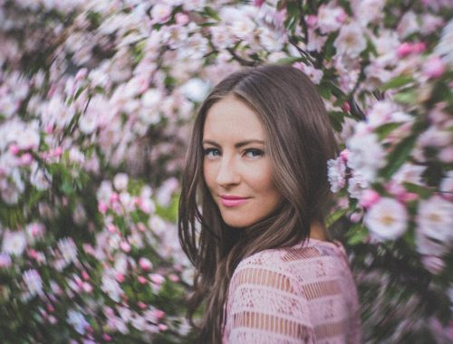 flower fashion photography - blossoms surrounding portrait by fashion photographer in melbourne
