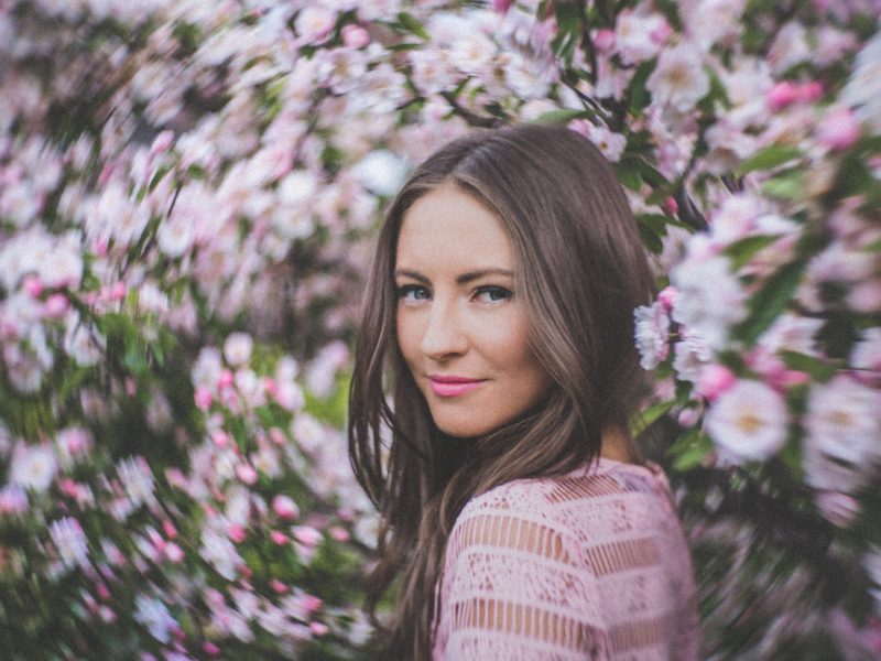 flower fashion photography - blossoms surrounding portrait by fashion photographer in melbourne